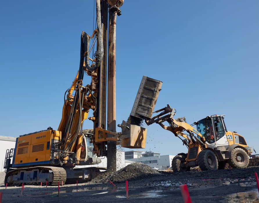 dozer-loading-gravel-ground-remediation-data-center-construction-site-frankfurt-main-desktop-michel-bau